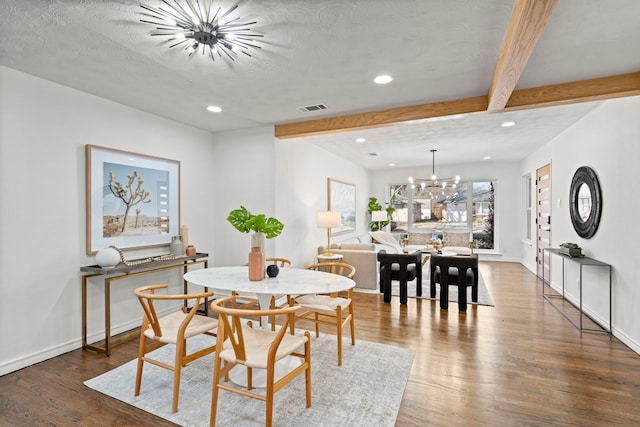 dining area featuring an inviting chandelier, dark hardwood / wood-style floors, a textured ceiling, and beamed ceiling