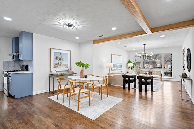 dining room with beamed ceiling, dark hardwood / wood-style flooring, a wealth of natural light, and a notable chandelier