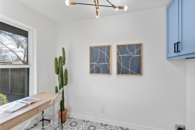 office space with a notable chandelier and a wealth of natural light