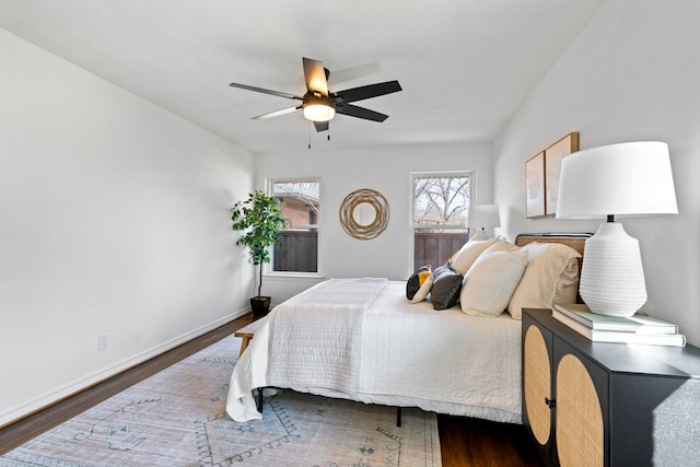 bedroom featuring ceiling fan and dark hardwood / wood-style flooring