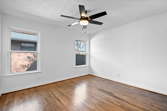 spare room featuring hardwood / wood-style flooring and ceiling fan