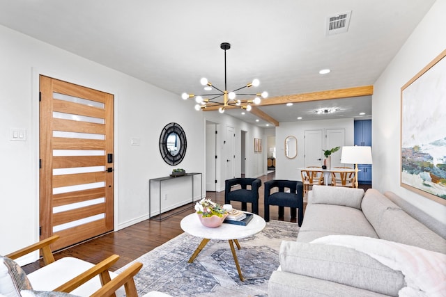 living room with a chandelier and dark hardwood / wood-style flooring