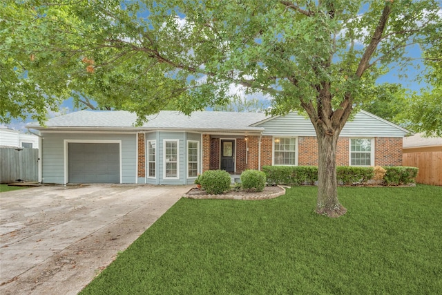 single story home featuring a garage and a front lawn