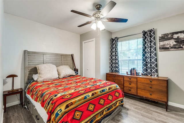 bedroom featuring hardwood / wood-style flooring and ceiling fan