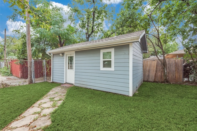 view of outdoor structure featuring a yard