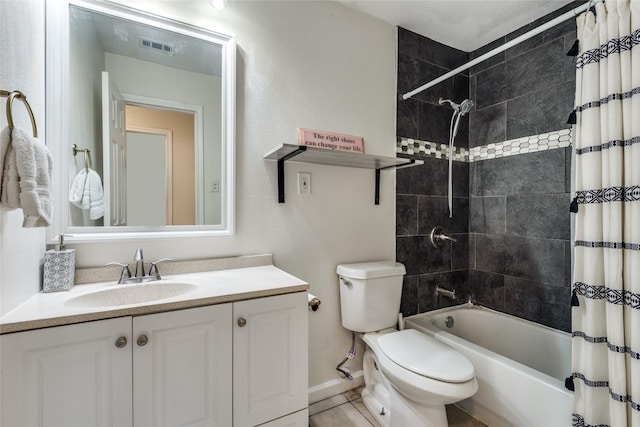 full bathroom featuring vanity, tile patterned floors, toilet, and shower / bath combo with shower curtain