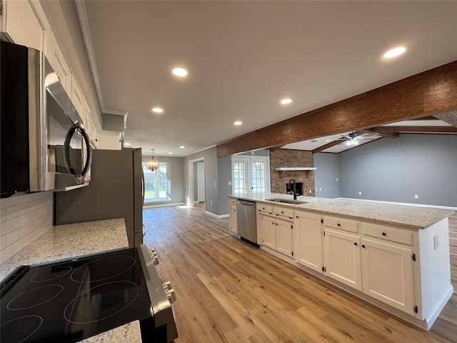 kitchen featuring tasteful backsplash, beamed ceiling, stainless steel appliances, light stone countertops, and white cabinets