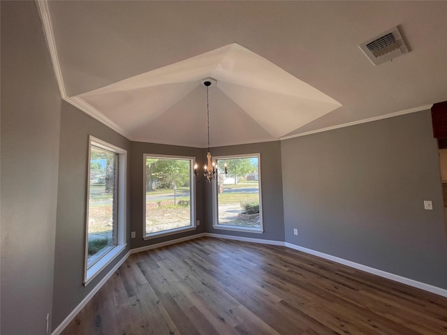 unfurnished dining area featuring a chandelier, vaulted ceiling, hardwood / wood-style floors, and a wealth of natural light