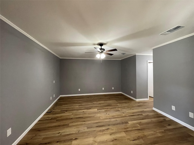 empty room with crown molding, ceiling fan, and wood-type flooring