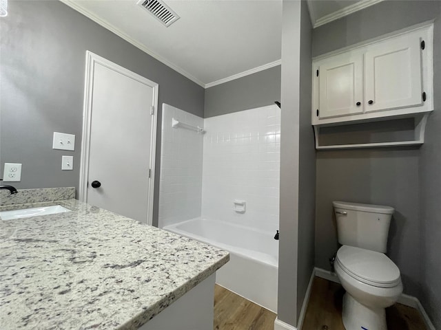 full bathroom with toilet, crown molding, wood-type flooring, vanity, and shower / bath combination