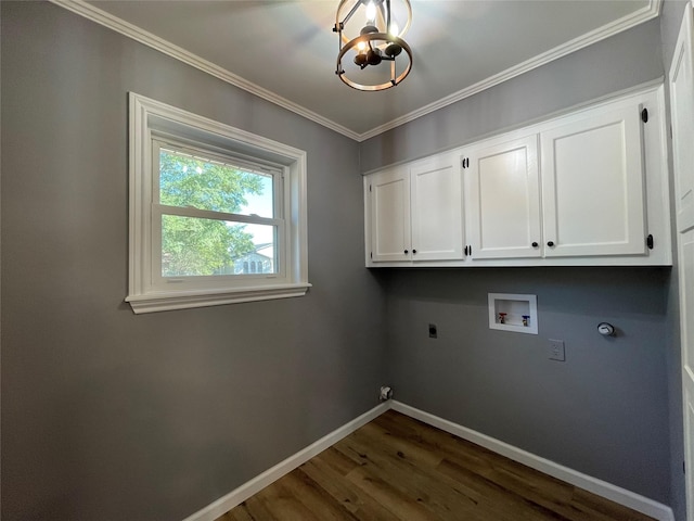 laundry area featuring gas dryer hookup, crown molding, electric dryer hookup, cabinets, and washer hookup