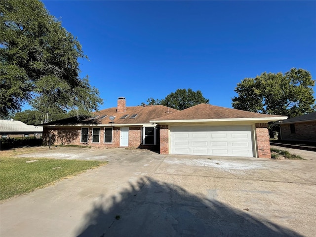 ranch-style house featuring a garage