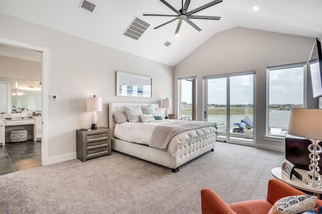 bedroom with ensuite bathroom, carpet flooring, access to exterior, and ceiling fan