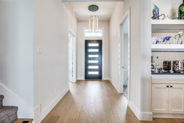 foyer entrance with light wood-type flooring