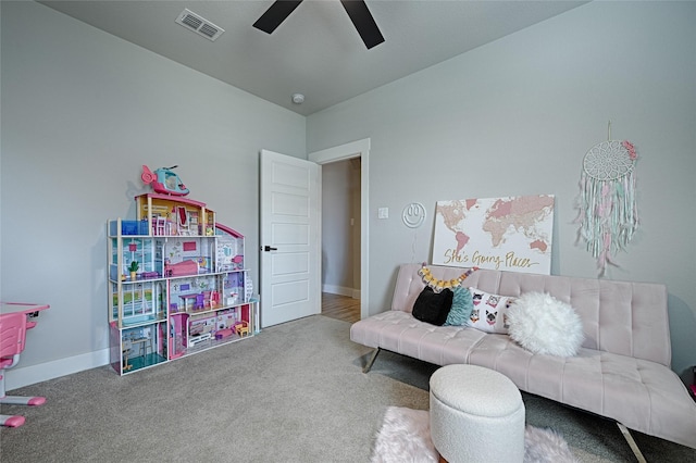 interior space featuring ceiling fan and carpet flooring