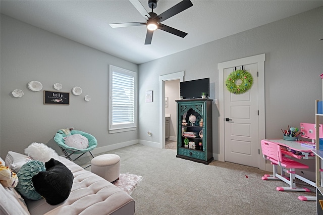 living room with light carpet and ceiling fan