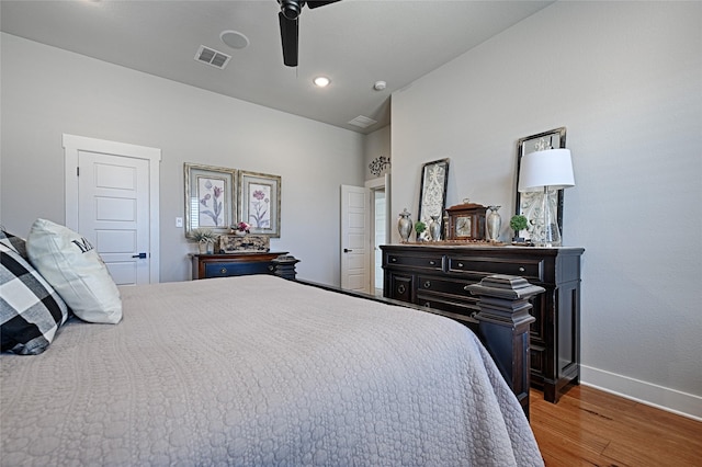 bedroom featuring lofted ceiling, dark hardwood / wood-style floors, and ceiling fan