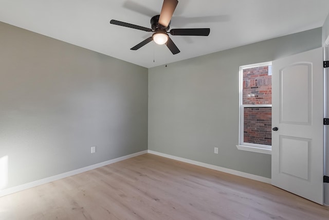 spare room featuring ceiling fan and light hardwood / wood-style floors