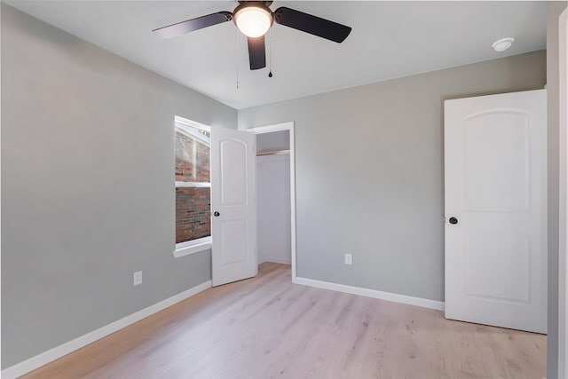 unfurnished bedroom featuring ceiling fan and light hardwood / wood-style flooring