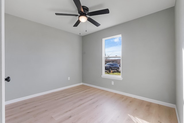 empty room featuring ceiling fan and light wood-type flooring