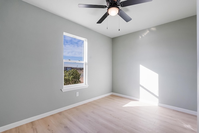 spare room with ceiling fan and light hardwood / wood-style floors