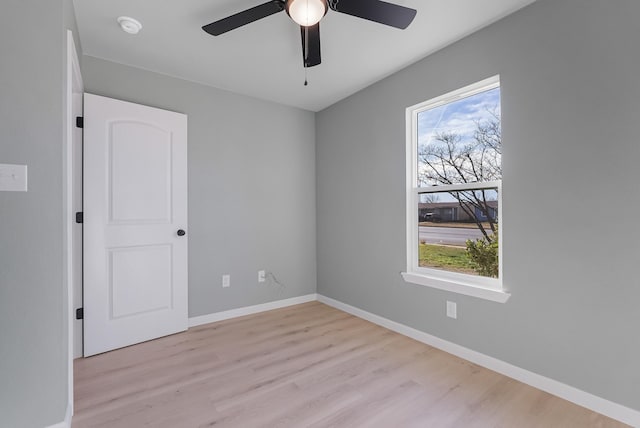 spare room with ceiling fan and light hardwood / wood-style flooring