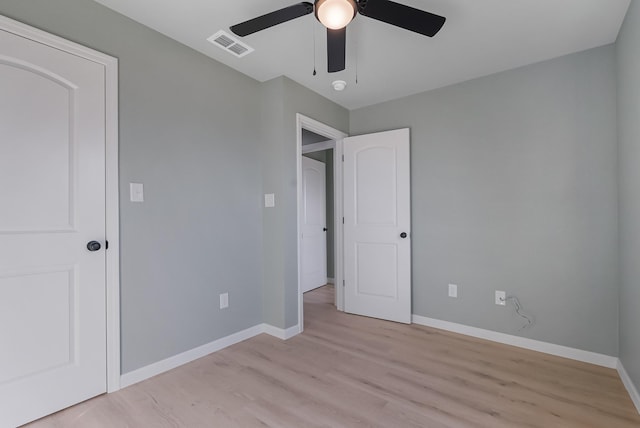 unfurnished bedroom with ceiling fan and light hardwood / wood-style floors