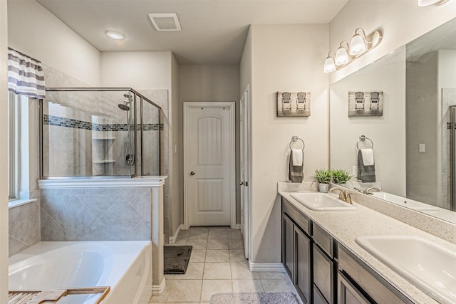 bathroom featuring tile patterned floors, shower with separate bathtub, and vanity