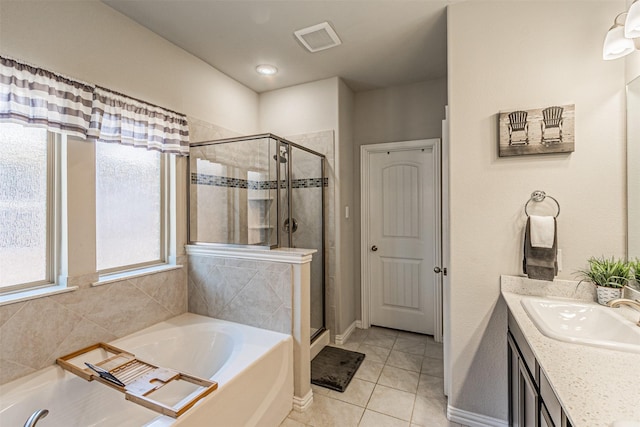 bathroom with vanity, tile patterned flooring, and separate shower and tub