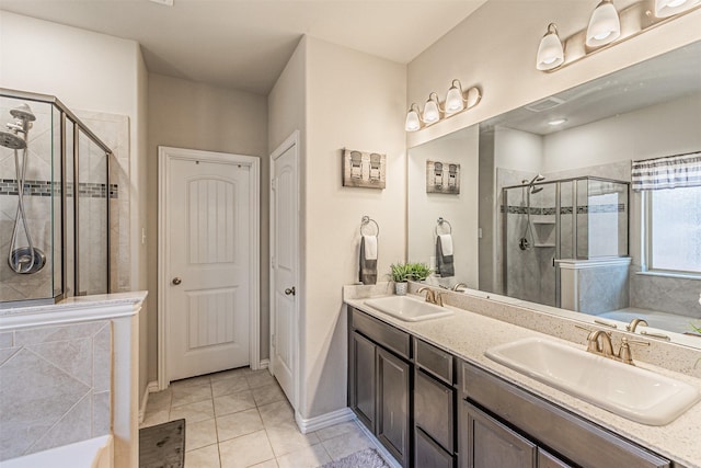 bathroom with tile patterned floors, shower with separate bathtub, and vanity