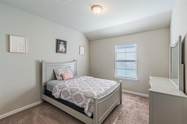 carpeted bedroom featuring lofted ceiling