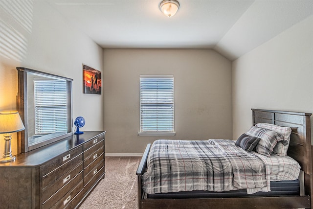 carpeted bedroom featuring vaulted ceiling