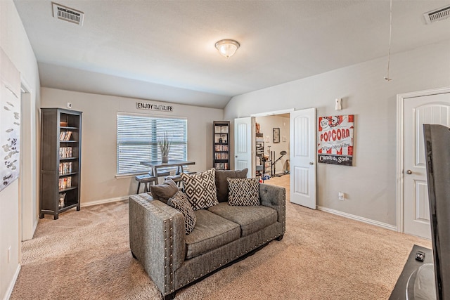 living room with vaulted ceiling and carpet floors