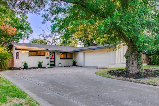 single story home featuring a garage