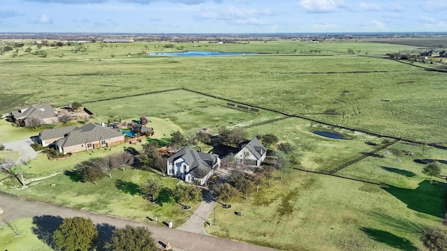 drone / aerial view featuring a water view and a rural view