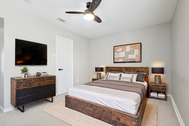 bedroom featuring a ceiling fan, visible vents, and baseboards