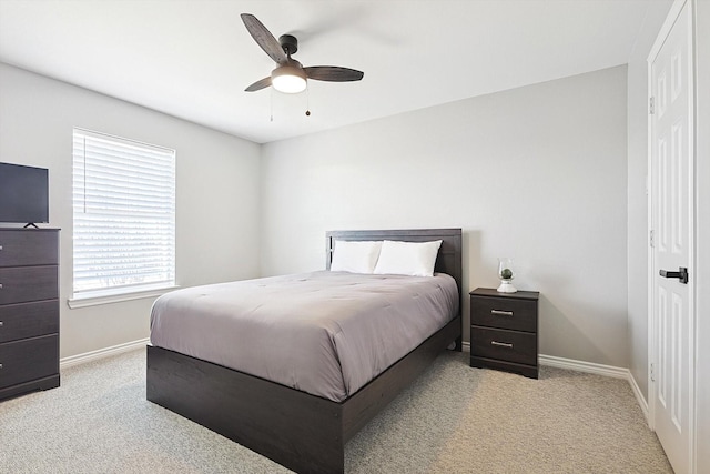 bedroom featuring a ceiling fan, carpet flooring, and baseboards