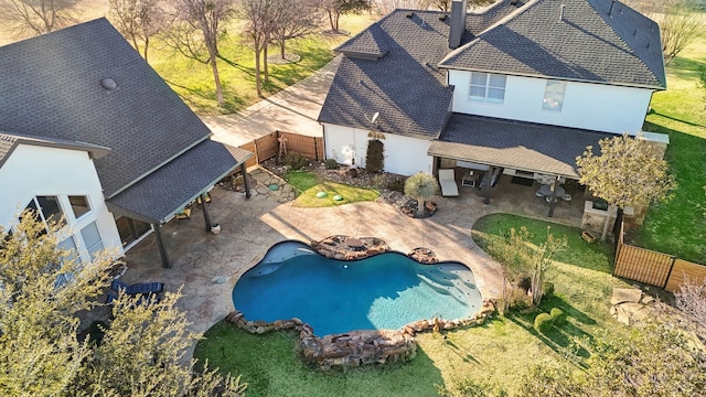 pool with a patio area and a fenced backyard