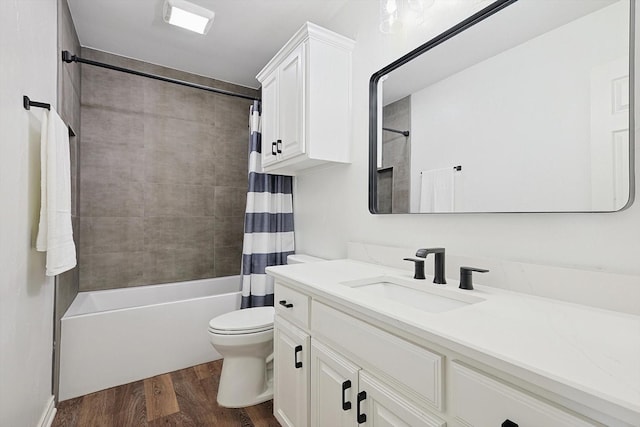 full bathroom featuring vanity, shower / bath combo, wood finished floors, and toilet