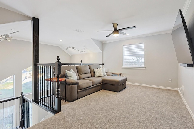 living room with vaulted ceiling, ornamental molding, carpet, and baseboards