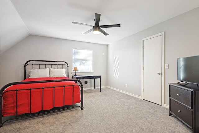 bedroom with lofted ceiling, ceiling fan, baseboards, and carpet flooring