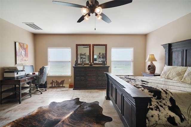 bedroom with multiple windows, light colored carpet, and ceiling fan