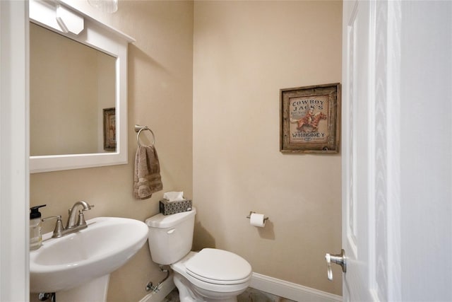 bathroom with toilet and sink