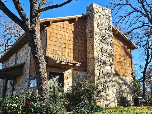 view of home's exterior with central AC unit