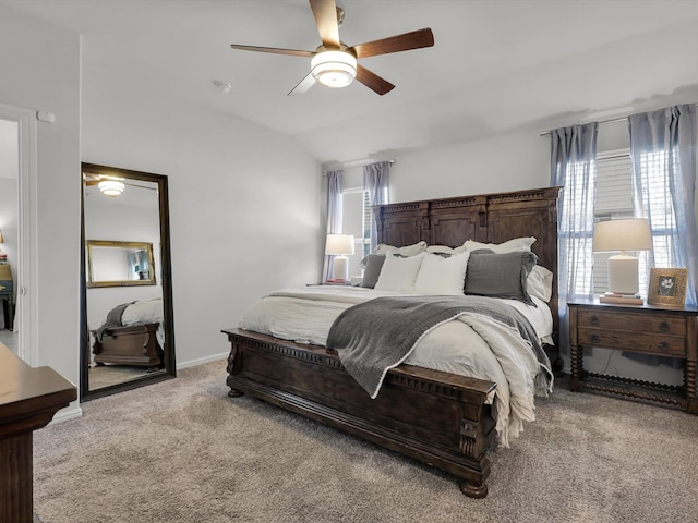 carpeted bedroom featuring lofted ceiling and ceiling fan