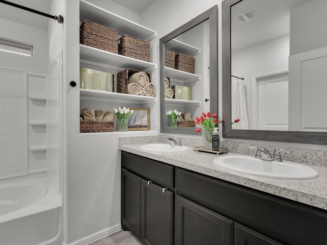 bathroom with shower / tub combination and vanity