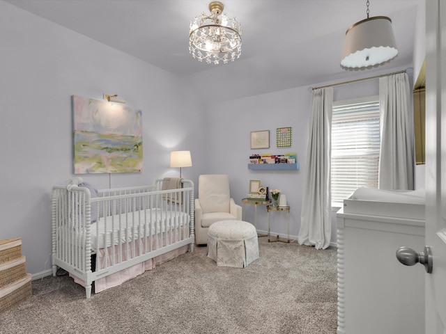 carpeted bedroom with lofted ceiling, a nursery area, and a notable chandelier