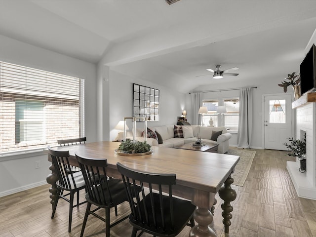 dining space with lofted ceiling and ceiling fan