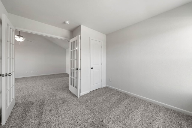 unfurnished room featuring lofted ceiling, carpet, ceiling fan, and french doors