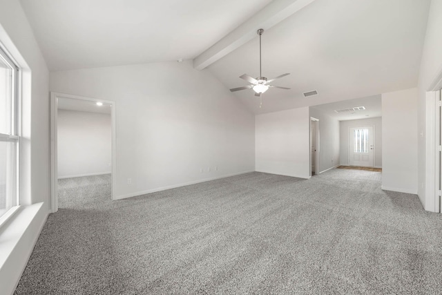 interior space with ceiling fan, lofted ceiling with beams, and light carpet